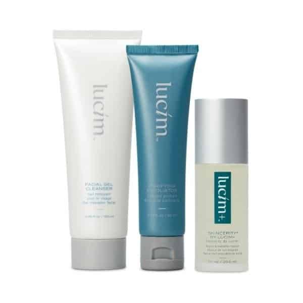 Three Lucim skin care products, including a cleanser, an exfoliator and a skin serum